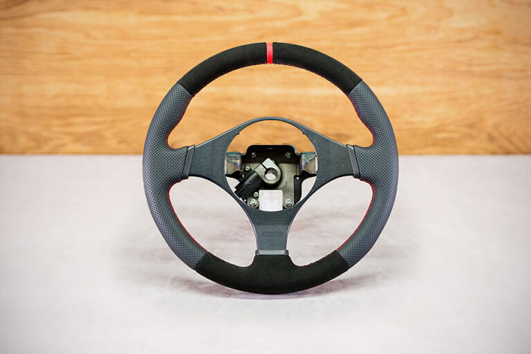 Obszycie kierownicy Mitsubishi Lancer VIII